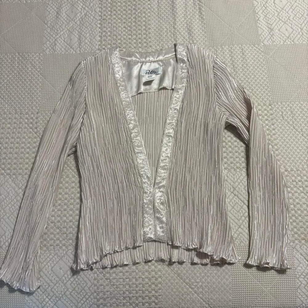 Creamy pleated blouse with beaded trim details. Size: 8